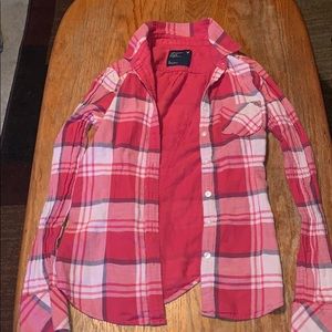 Plaid button up shirt.